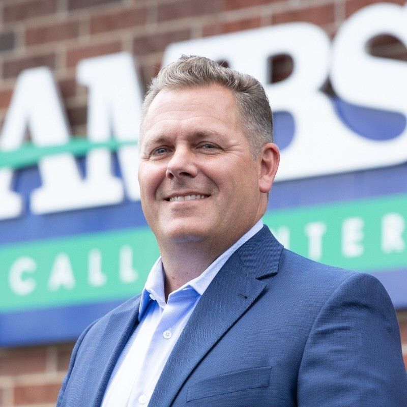 Man standing outside of Ambs Call Center office location