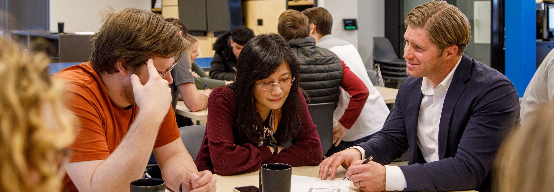 digital strategist works with team members in a workshop