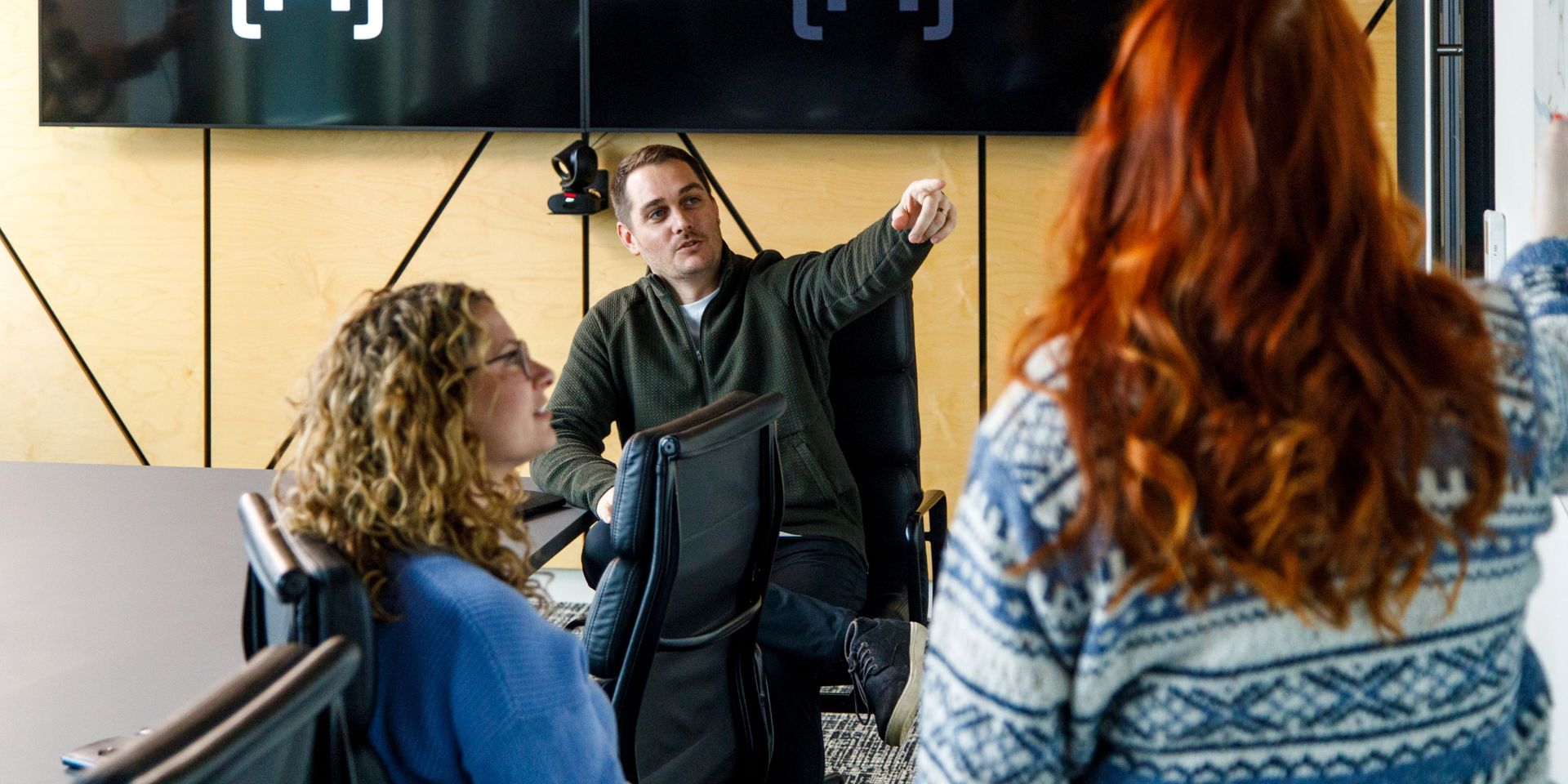 product manager points to whiteboard