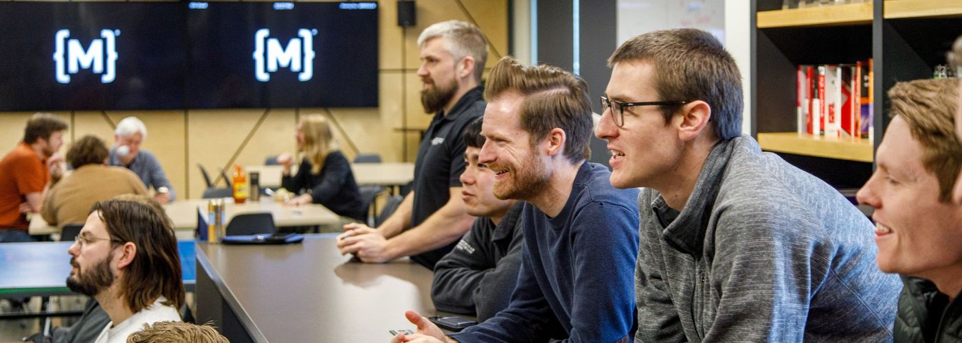 team members play video games at lunch